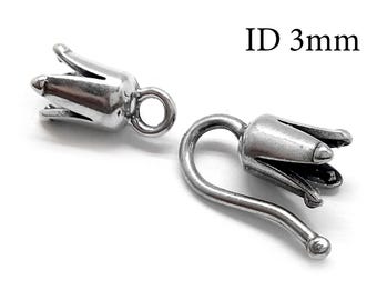 May include: Two silver-toned metal jewelry findings shaped like flower buds. One piece features a small circular loop, while the other has a curved hook ending in a ball. The text ID 3mm is visible in the upper right corner, indicating the internal diameter.