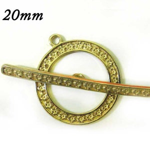 2 sets Decorative Toggle Clasp in Brass, with flowers Size: Loop 20 mm Bar 34 mm, finishes Antique Brass/Copper - Shiny Brass/Copper