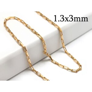May include: A gold chain necklace with a 1.3x3mm box chain link pattern.