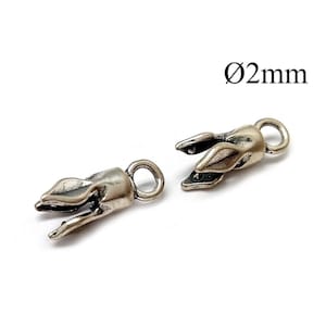 May include: Two silver-toned metal cord end caps with a tulip-like shape and a small circular loop at the top. Each piece features a hollow opening designed to hold a cord with a diameter of 2mm, as indicated by the text Ø2mm in the image.