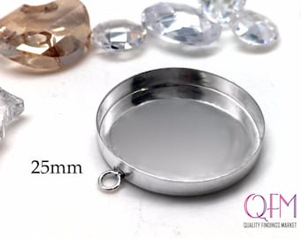 May include: A silver-toned, round, 25mm bezel setting with a loop for attaching a pendant or charm. The bezel is designed to hold a flat-backed cabochon or other decorative element.