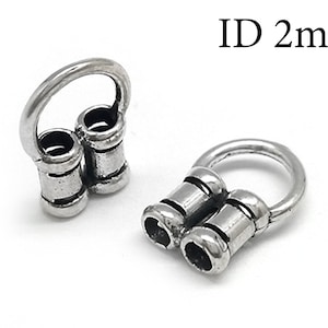 May include: Silver-toned metal connector with a 2 mm inner diameter. The connector has two cylindrical loops that can be used to attach cords or chains.