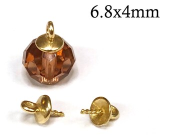 May include: A faceted amber-colored crystal bead topped with a gold-toned metal cap and loop, accompanied by two separate gold-toned metal bead caps with integrated loops and pins. The text 6.8x4mm is visible in the upper right corner.