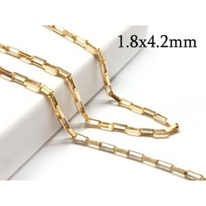 May include: Gold chain with rectangular links, measuring 1.8 x 4.2 mm.