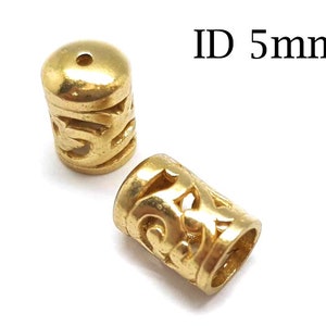 May include: Two gold-colored metal end caps with an intricate design. The end caps have a 5 mm inner diameter. ID 5mm.