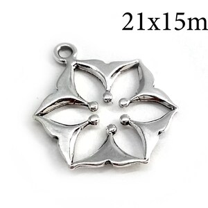 May include: Silver-toned metal charm in the shape of a six-pointed star with a cutout design. The charm measures 21x15mm.