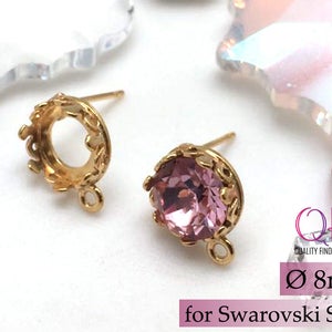 May include: Gold-tone earring settings with a 8 mm round opening, designed to fit Swarovski SS39 crystals. The settings have a delicate crown design and a loop for attaching a dangle charm.