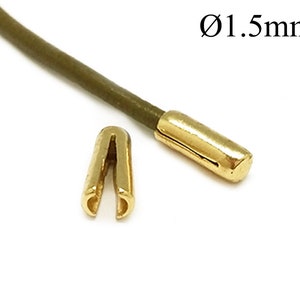 May include: Gold cord ends with a 1.5 mm diameter. One end is a closed loop and the other is a straight end.