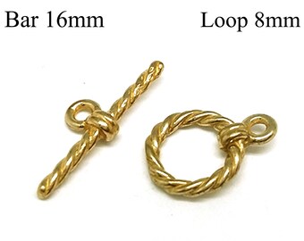 May include: Two gold-tone metal clasps for jewellery making. The clasp on the left is a bar clasp measuring 16 mm in length. The clasp on the right is a loop clasp measuring 8 mm in diameter. Both clasps have a rope-like design.