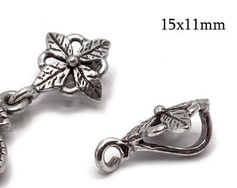 May include: Close-up of two silver-coloured jewellery findings. One is a floral design with a central bead and leaf details. The other is a leaf-shaped design with a curved hook. Text in the image reads "15x11mm".
