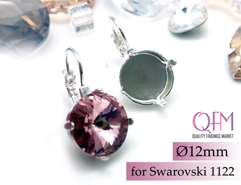 May include: Silver earring settings for 12mm round Swarovski crystals. The settings are designed to fit Swarovski 1122 crystals.  The settings are shown with a light pink crystal.
