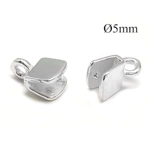 May include: Two silver-coloured metal cord crimp ends with a smooth, polished finish. Each piece features a U-shaped channel for securing cord and a small circular loop at the top for attachment. The text Ø5mm is visible in the upper right corner.