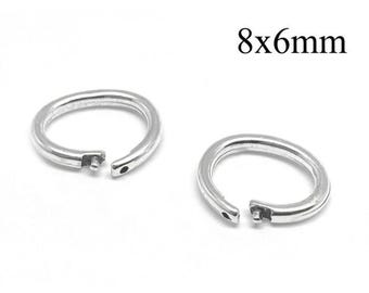 May include: Two silver-colored circular jump rings with a hinged opening mechanism, each featuring a small pin and hole closure. The text 8x6mm is printed in black above the rings, indicating the dimensions of these metal jewelry components.