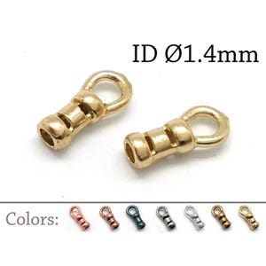 May include: Two gold-toned metal crimp end findings with a loop at one end and a cylindrical opening at the other. The text ID Ø1.4mm is visible. A row of seven additional crimp ends in various metallic colors is displayed below the main items.