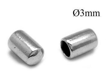 May include: Two small, cylindrical, silver-coloured metal crimp beads with a smooth, reflective finish. Each bead features a hollow centre and a rounded end. The text Ø3mm is clearly visible in the upper right corner, indicating a diameter of 3mm.