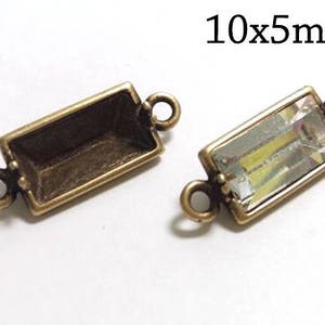 May include: Two rectangular antique brass connectors, each with a loop on either end. One is empty, the other holds a clear, faceted crystal. The text "10x5mm" is in the upper right corner, indicating the size of the connectors.