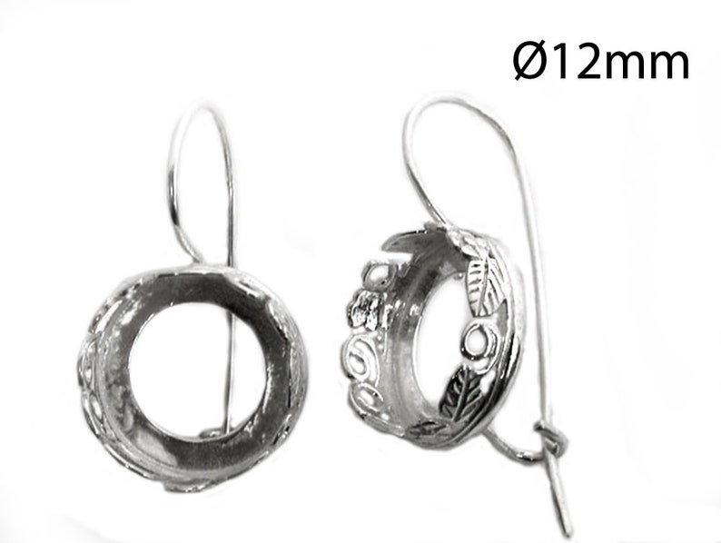 May include: Silver earring settings with a 12mm round opening. The settings have a decorative floral design.