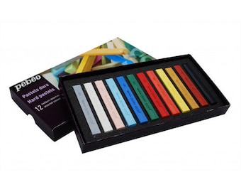 May include: A set of 12 Pebeo pastels durs hard pastels in a black box. The pastels are arranged in a row, with the colors ranging from white to dark brown. The box has the text "Pastels durs Hard pastels" and "12" printed on it.