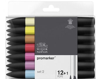 May include: A set of Winsor & Newton Promarkers in a clear plastic case. The markers have black barrels and colored tips in shades of yellow, orange, red, pink, purple, and blue. The packaging includes the text "Promarker" and "set 2 12+1 PC/PZ".