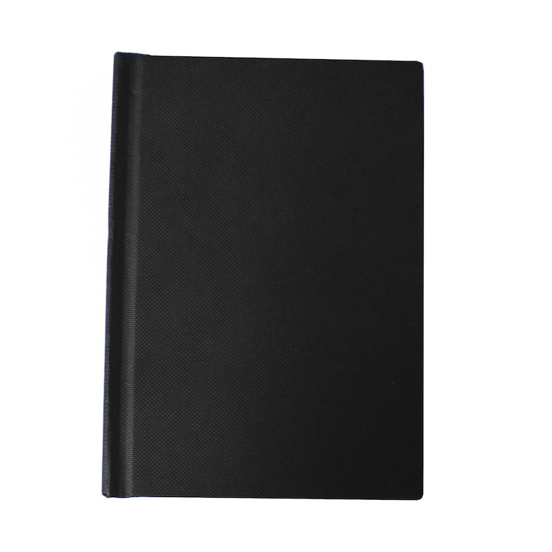May include: A black notebook with a textured cover.