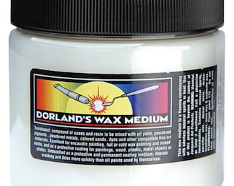 May include: A white jar with a black lid labelled "Dorland's Wax Medium". The label has a yellow background with a red and white illustration of a tool. The label text describes the product as a translucent compound of waxes and resin to be mixed with oil paint, powdered pigments, powdered metals, coloured sands, dyes and other compatible fine art media.
