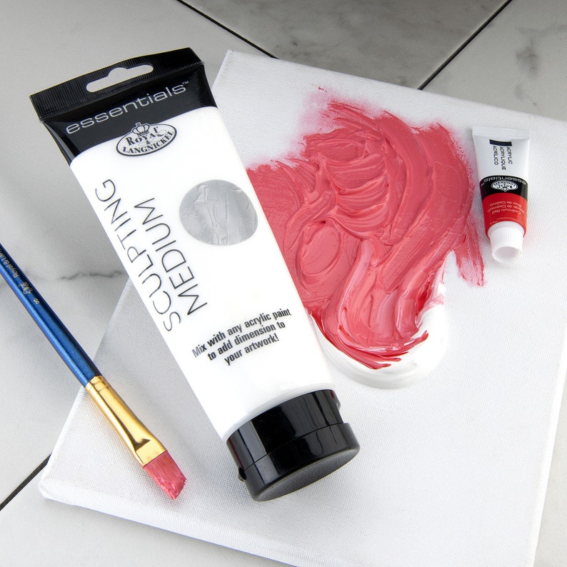 May include: A white tube of Royal Langnickel essentials sculpting medium with the text "Mix with any acrylic paint to add dimension to your artwork!"  A small tube of acrylic paint is also visible in the image.