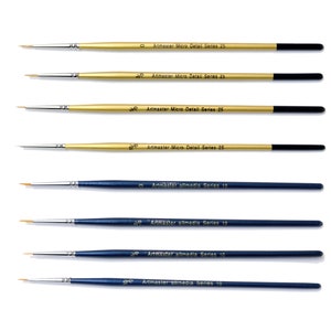May include: A set of eight paint brushes, four with gold handles and four with blue handles. The gold handled brushes are labelled "Artmaster Micro Detail Series 25" and the blue handled brushes are labelled "Artmaster allmedia Series 10".