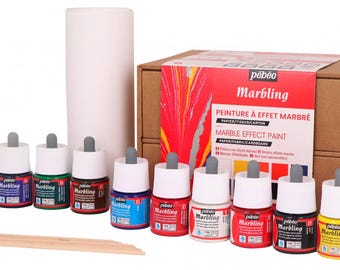 May include: A set of 10 bottles of Pebeo Marbling paint in various colors, including red, blue, green, yellow, and black. The bottles are arranged in a row on a wooden surface. The paint is designed for marbling effects on paper, fabric, and cardboard. The set also includes a roll of white paper and wooden sticks.