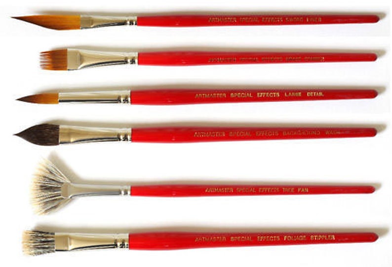 May include: Set of six paint brushes with red handles and silver ferrules. The brushes have different shapes and sizes, including a fan brush, a round brush, and a flat brush. The handles are labeled with the words "Artmaster Special Effects" and the specific brush type.