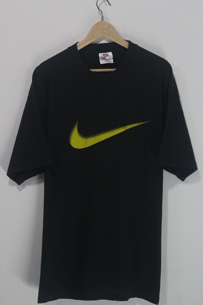 ON SALE 25% Vintage 90s Nike chest big yellow logo sportswear style tee ...