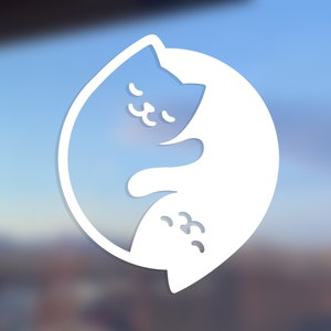 May include: White silhouette of two cats curled up together in a yin yang design.