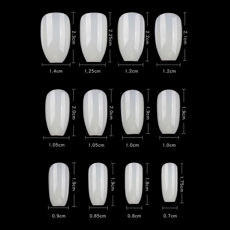 May include: Set of 12 white oval-shaped false nails with different sizes. The nails are measured in centimeters.
