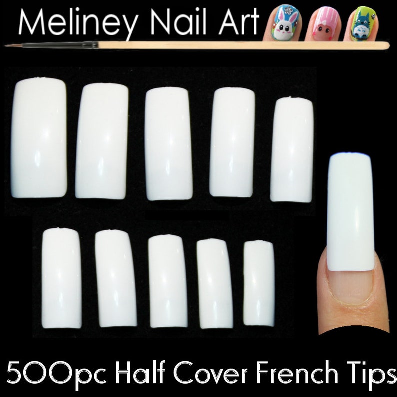 May include: 500 white half-cover French nail tips in various sizes. The tips are arranged in two rows of seven, with one tip on a finger.