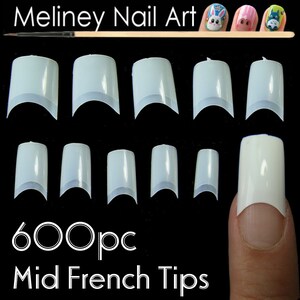 May include: 600 piece set of clear plastic mid-french nail tips. The tips are arranged in rows of eight, with a finger wearing a tip on the right side of the image.