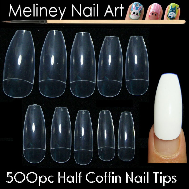 May include: 500 clear half coffin shaped nail tips for nail art. The tips are arranged in rows on a black background. A single white nail tip is shown on a finger.