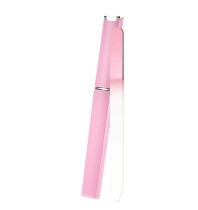 May include: A pink nail file with a white, rectangular case. The file is made of glass and has a smooth, polished surface.