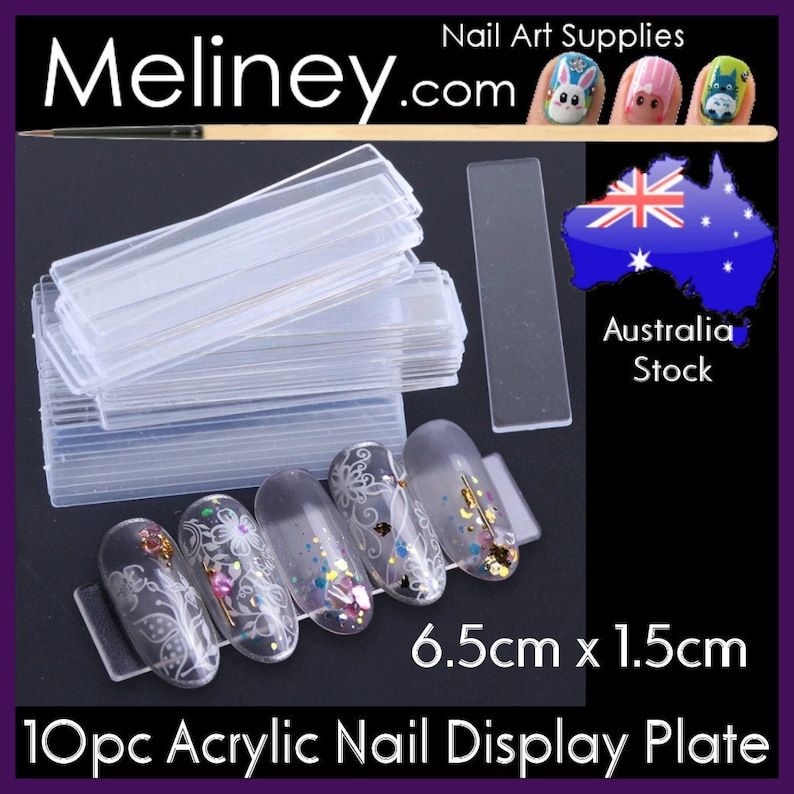 May include: 10 clear acrylic nail display plates, each measuring 6.5 cm by 1.5 cm. The plates are stacked and show a close-up of a few plates with fake nails on them. The nails are decorated with glitter and white designs.