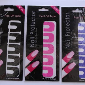 May include: Three packs of nail protector peel-off tape. Each pack has a black background with white text that reads "Nail Protector for Nail Art Painting" and "Peel Off Tape". The packs show a finger with pink, purple, and white nail polish, with the tape applied to the finger.