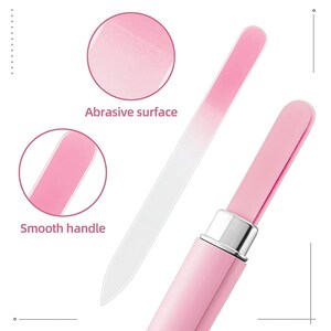 May include: A pink glass nail file with a smooth handle and an abrasive surface. The file is retractable and fits into a pink case.