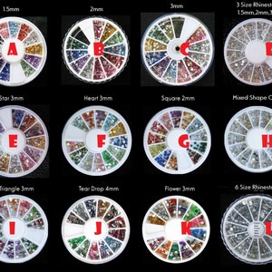 May include: Ten round containers with different sizes and shapes of rhinestones. Each container has a label with the size and shape of the rhinestones. The containers are arranged in a grid pattern. The containers are white with a clear lid. The rhinestones are clear, silver, gold, and multi-coloured.