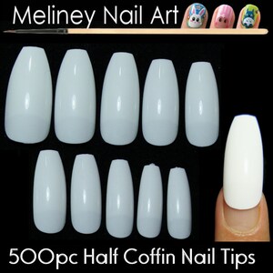 May include: 500 white half coffin shaped nail tips. The tips are arranged in two rows of 7, with one tip on a finger.