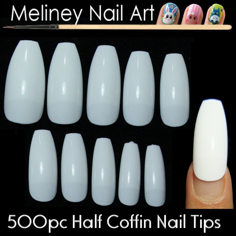 May include: 500 white half coffin shaped nail tips. The tips are arranged in two rows of 7, with one tip on a finger.