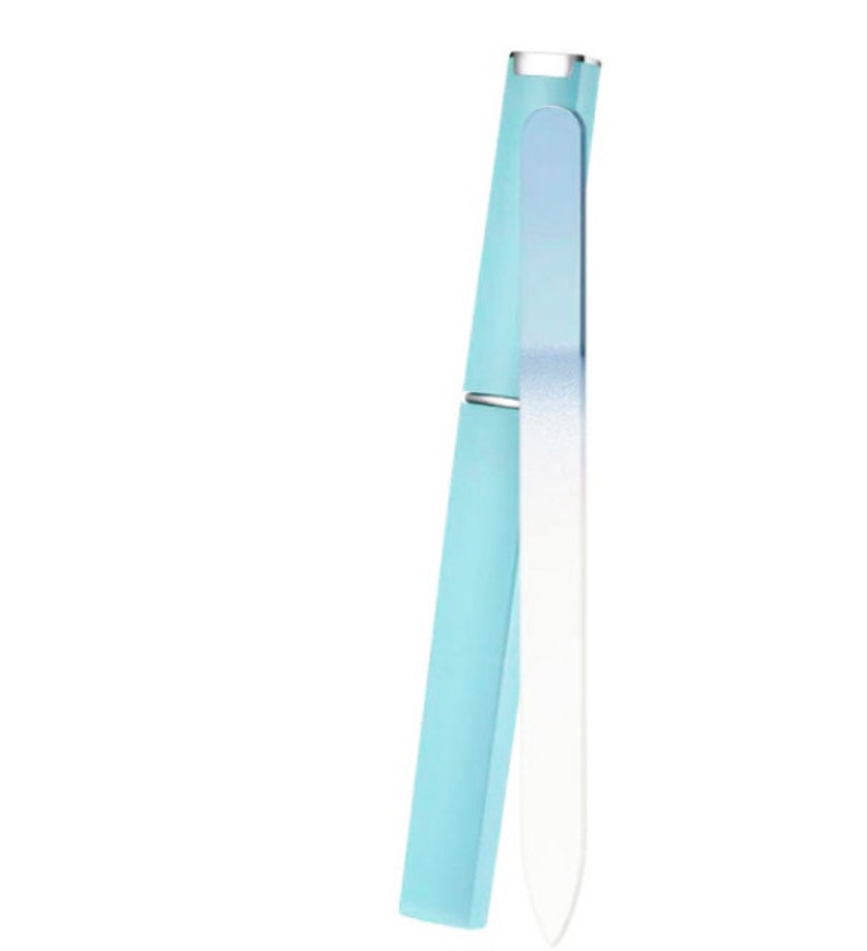 May include: A light blue nail file with a white tip, encased in a matching light blue protective case.
