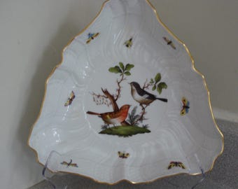 May include: A white porcelain triangular serving dish with a gold rim. The dish features a hand-painted design of two birds and butterflies on a floral background.
