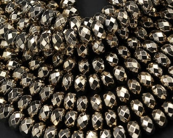 May include: A strand of faceted, metallic gold hematite beads. The beads are round and have a smooth, polished finish.