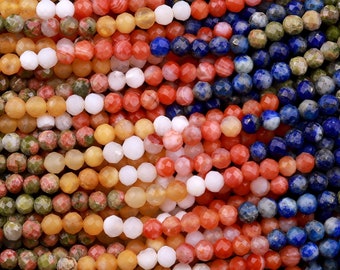 May include: A close-up of a variety of gemstone beads, including green, orange, blue, and white. The beads are faceted and have a polished finish.