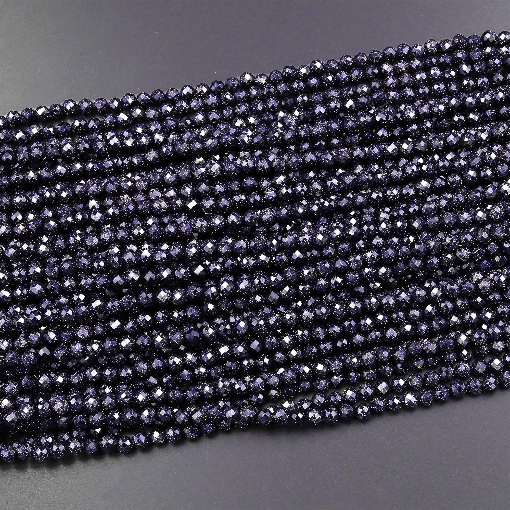 thumbnail interactive-video image 1 of Blue Sandstone Gemstone Round Faceted Beads For Jewelry Making - 2mm, Gold Flash, 25+ Pieces 1 of 5