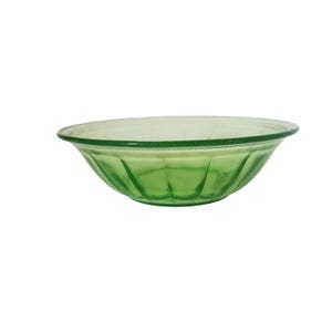 May include: A green glass bowl with a rounded shape and a decorative rim. The bowl has vertical ridges along the sides and is made of transparent green glass. This bowl is suitable for serving food.