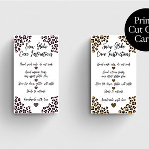 May include: Two printable care cards for snow globes with a leopard print background and pink and gold hearts. The cards have instructions for caring for the snow globes, including hand washing only, avoiding extreme temperatures, and shaking to activate the glitter.