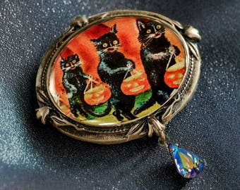 Spilla gatto nero di Halloween: spilla smaltata "Dolcetto o scherzetto"